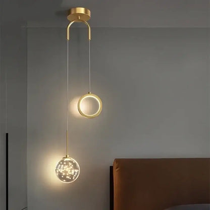 Modern gold ring led pendant light featuring a sleek circular fixture with a glowing ring and crystal globe decorbites gold ring