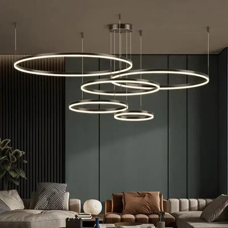 Modern gold ring pendant ceiling lamp with concentric circular rings and soft white led glow for dining room decorbites gold ring