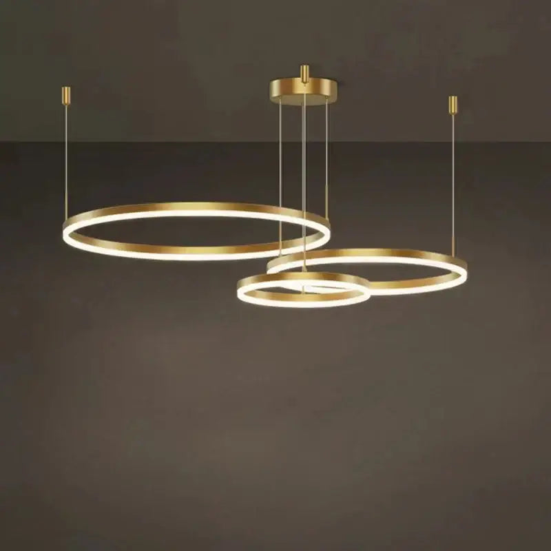Modern gold ring pendant ceiling lamp with sleek minimalist design for dining room decor by decorbites gold ring pendant