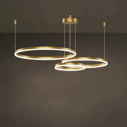 Modern gold ring pendant ceiling lamp with sleek minimalist design for dining room decor by decorbites gold ring pendant