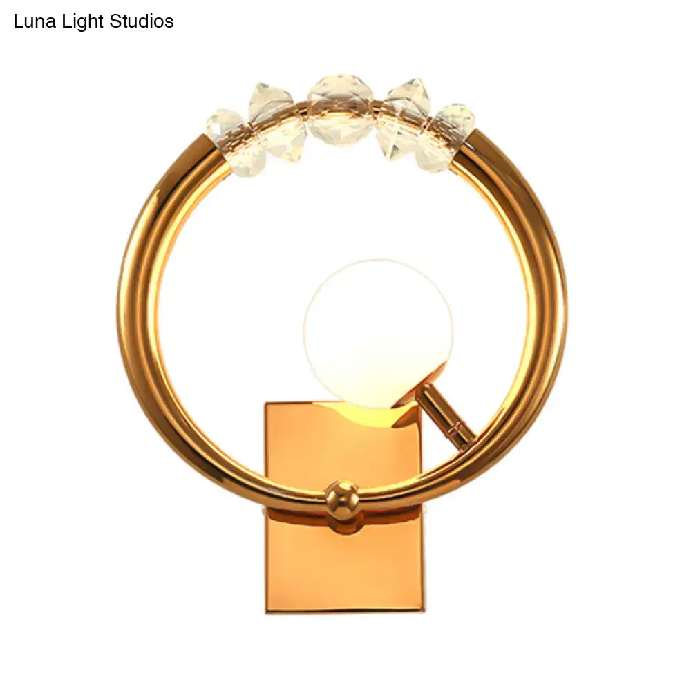 Modern gold ring wall sconce with clear crystal accents and a glowing bulb suitable for 110v-120v or 220v-240v ring wall use