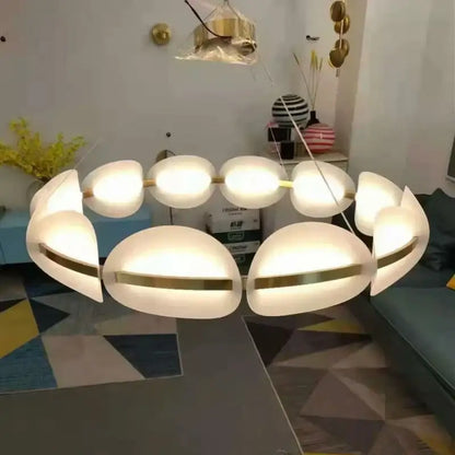 Modern white oval pendant light with gold ring metallic accents and white acrylic petal design for dining room decorbites gold ring
