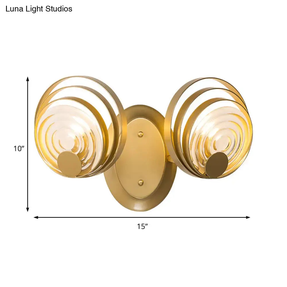 Gold-finished modern wall light with ripple glass circular concentric shades for living room light fixture