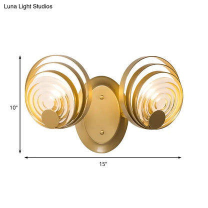 Gold-finished modern wall light with ripple glass circular concentric shades for living room light fixture