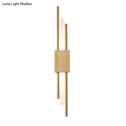 Modern gold-toned wall light with sleek vertical rods and frosted glass accents suitable for 110v-120v use