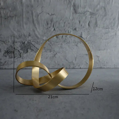 Modern gold rope knot metal sculpture with interlocking circular bands for home decor by decorbites gold rope