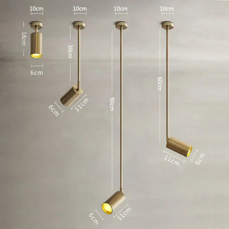 Modern gold rotating led spotlights featuring gold-finished cylindrical pendant lights with adjustable arms and warm led bulbs