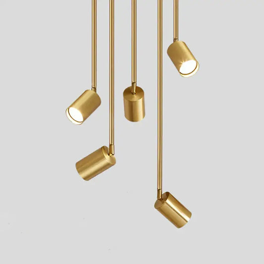 Five modern gold-finished rotating led spotlights with cylindrical heads and slender rods for dining room pendant light