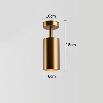 A sleek cylindrical gold rotating led spotlight with matte metallic finish and dimensional markings for dining rooms
