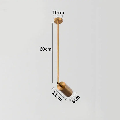 A sleek modern gold brass pendant light with cylindrical shade and slender stem featuring rotating led spotlights
