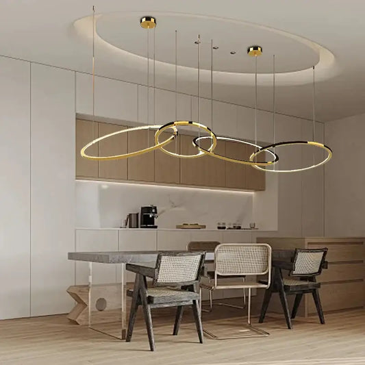 Modern gold round ceiling chandelier with sleek intersecting ring design for dining room decorbites gold round pendant light