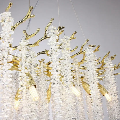 Modern gold round crystal branches chandelier featuring golden textured accents and cascading clear crystal beads for dining room decorbites gold round