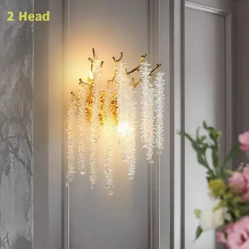 Modern gold round crystal branches chandelier wall sconce with two gold-toned arms and clear crystal droplets decorbites gold round
