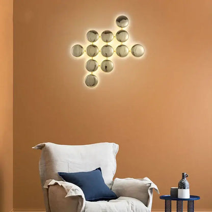 Modern gold round led wall lamps featuring interconnected spherical glass elements with warm glowing illumination for decorbites wall lamps