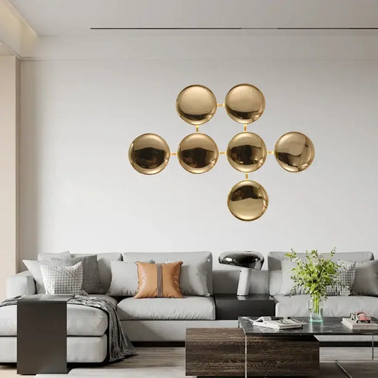 Modern gold round led wall lamps featuring gold-toned spherical decorbites gold round minimalistic design for living room decor