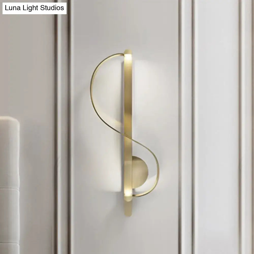 Modern gold s-shape wall lighting fixture with sleek curved design and integrated lighting for living room corner