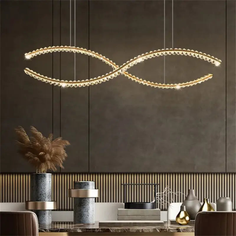 Modern gold s-shaped decorbites crystal led pendant light with infinity design and embedded crystal accents for dining room