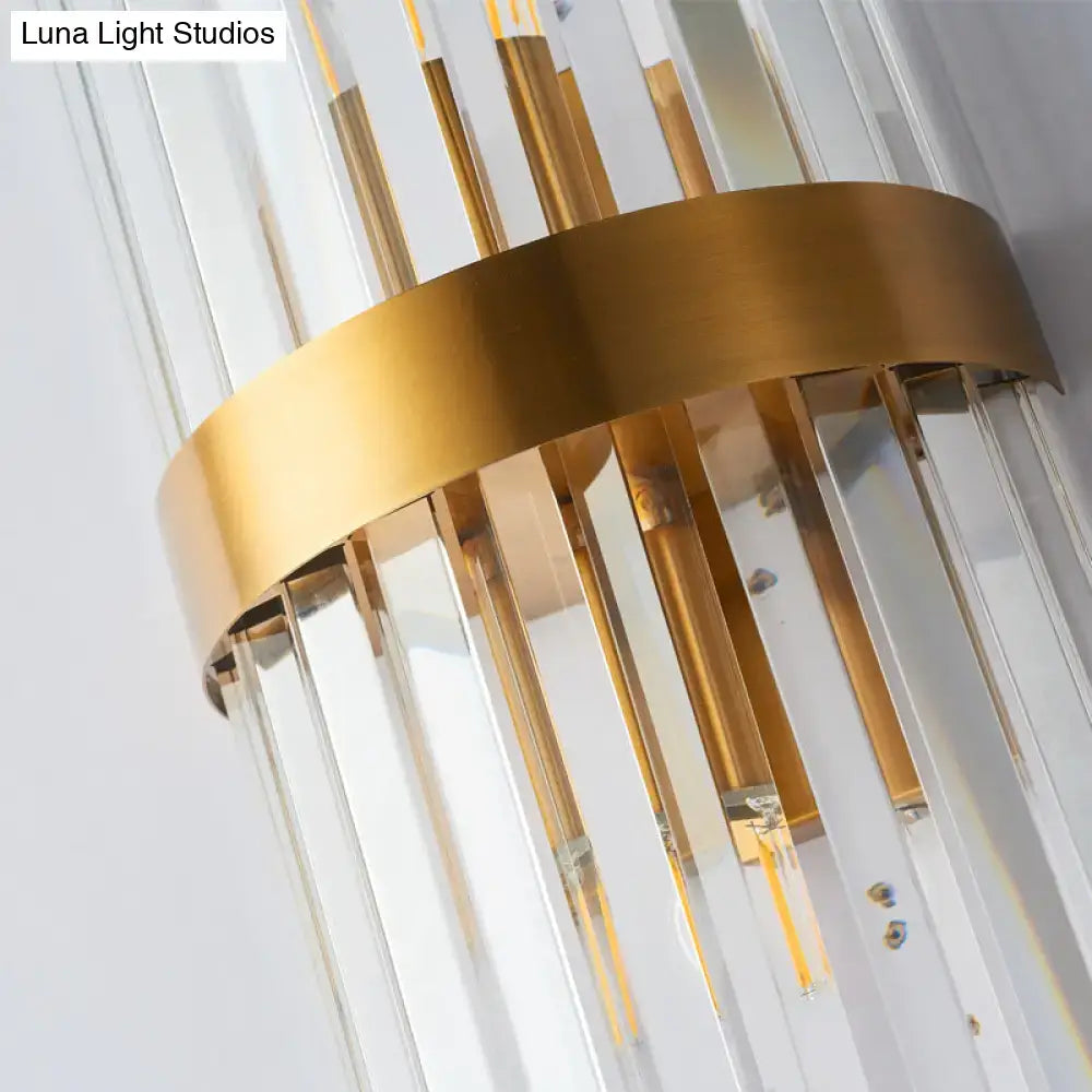 Modern gold sconce light wall lamp with clear acrylic crystal rods and gold-toned vertical design for bedroom use