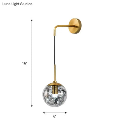Modern gold wall sconce with clear glass shattered leaf globe and black cord light fixture for bedroom use