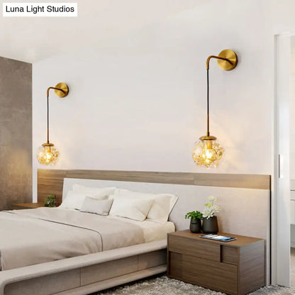 Modern gold shattered leaf clear glass globe sconce with faceted shades and black cords for bedroom light fixture