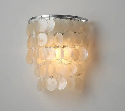 A warm glowing modern gold shell chandelier with iridescent mother-of-pearl shells for living room decorbites gold shell