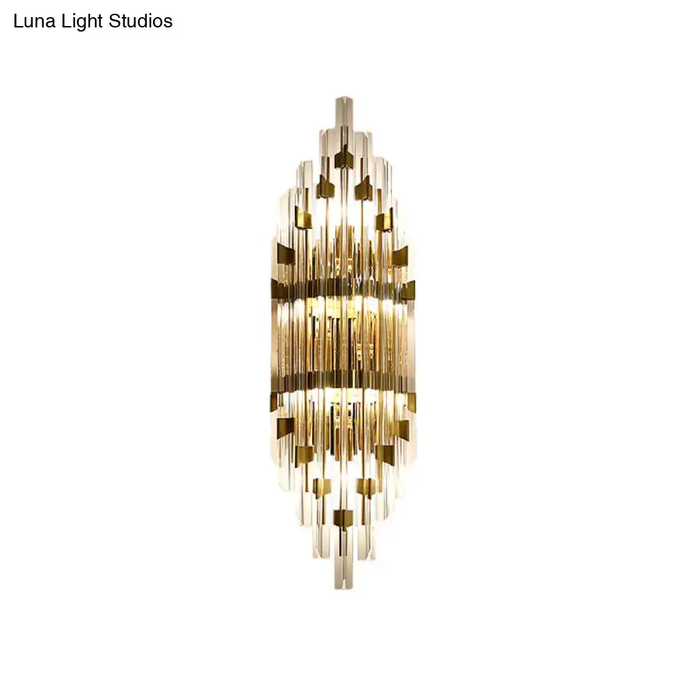 Modern gold shield 3-light wall sconce with cascading clear glass rods and gold accents for living room lighting