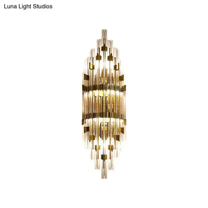 Modern gold shield 3-light wall sconce with cascading clear glass rods and gold accents for living room lighting