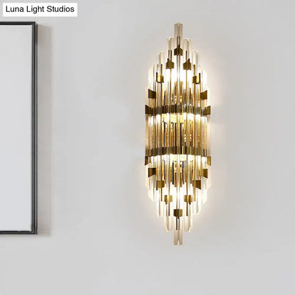 Modern gold shield 3-light wall sconce with vertical crystal rods and metallic accents for living room lighting