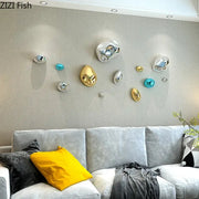 Modern gold and silver 3d stone wall ornaments with shiny metallic reflective surfaces for living room wall decor