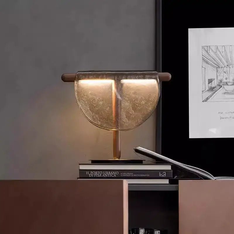 Modern gold and silver amber glass table lamp with translucent amber glass shade and wooden accents for bedroom decorbites decor
