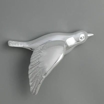 Modern silver bird resin statue wall decor with detailed feather texture and polished metallic finish for children room