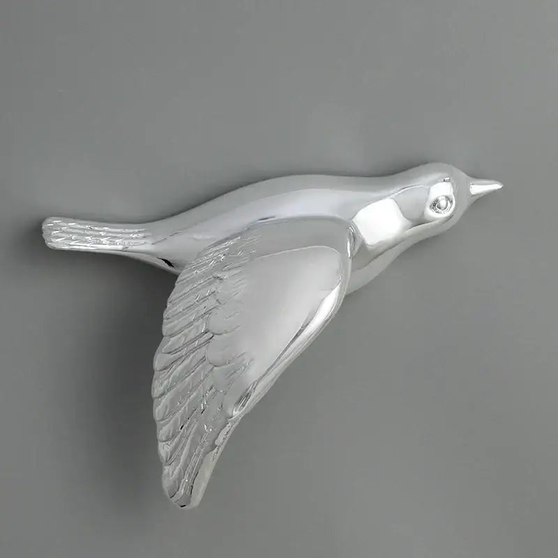 Modern silver bird resin statue wall decor with detailed feather texture and polished metallic finish for children room