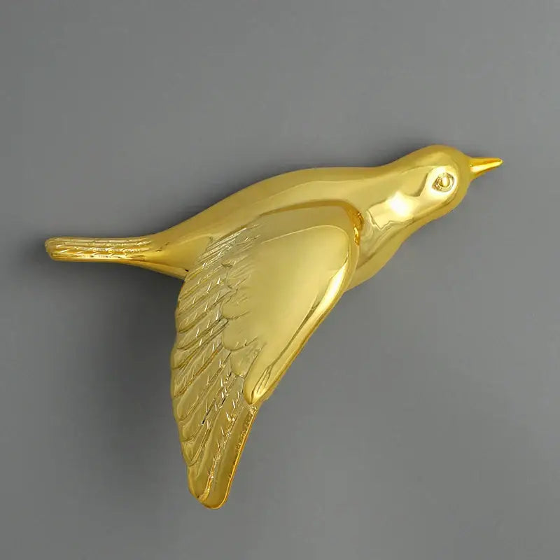 Modern gold bird resin statue wall decor with detailed feather texture and polished finish for children’s room