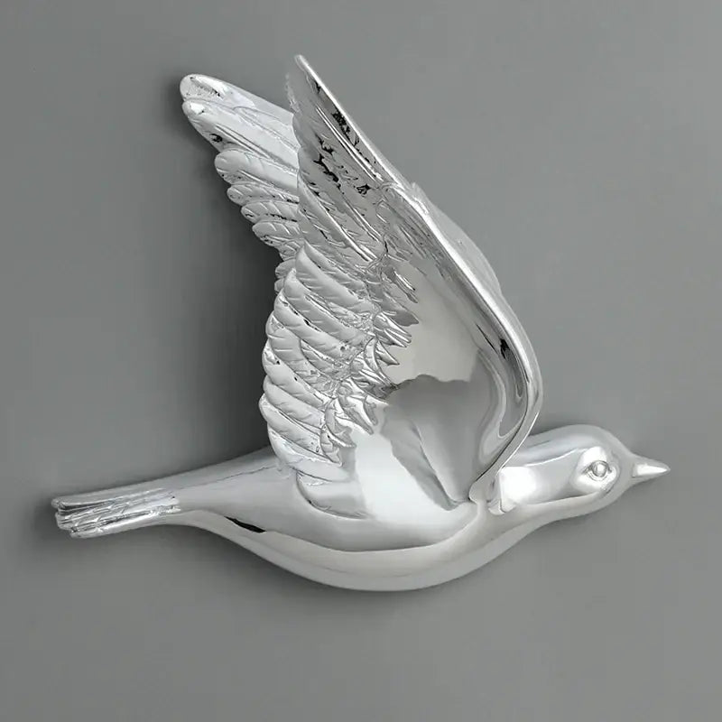 Modern silver bird resin statue wall decor with detailed sculpted wings and smooth reflective finish for children’s room