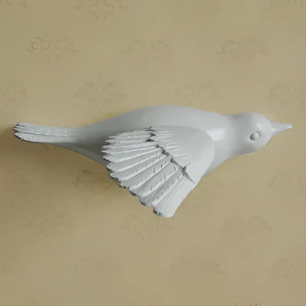Modern gold and silver white ceramic bird resin statue wall decor with detailed feathered wings for children’s room
