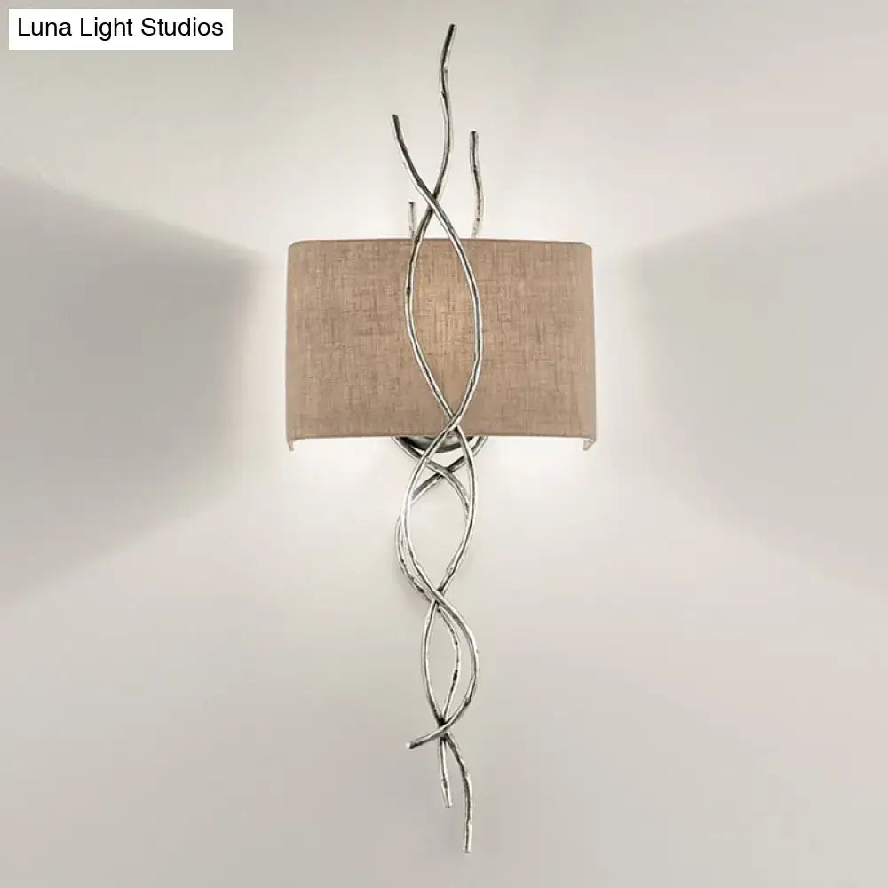 Silver twisted wire wall mount light with beige linen shade in modern gold silver branch design for bedroom