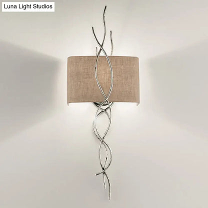 Silver twisted wire wall mount light with beige linen shade in modern gold silver branch design for bedroom