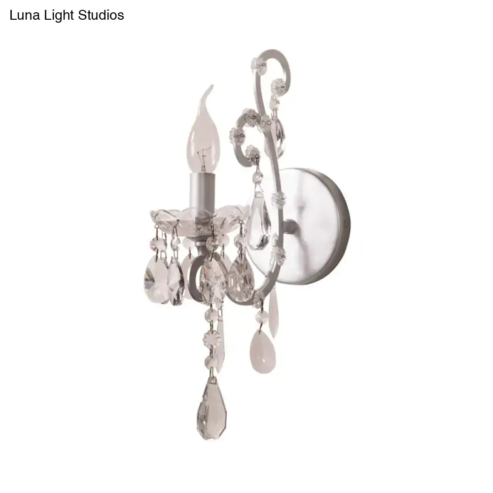 Elegant silver gold sconce light with crystal drop design and silver-finished metal frame for living room decor
