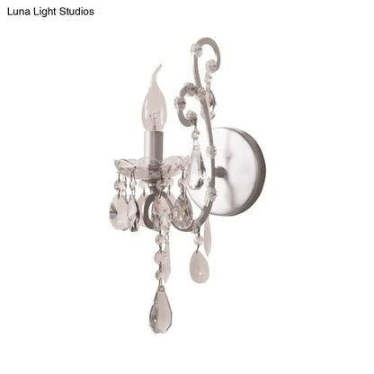 Elegant silver gold sconce light with crystal drop design and silver-finished metal frame for living room decor