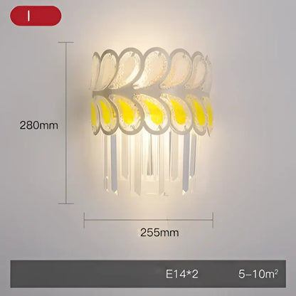 Modern gold and silver decorbites crystal wall sconce with cascading translucent leaf design and warm yellow led stainless steel light