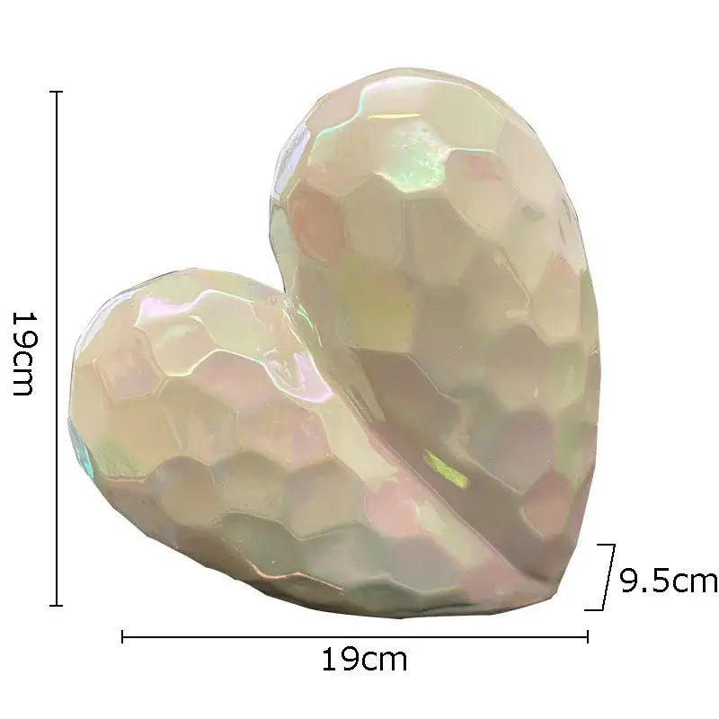 Glossy iridescent ceramic statue honeycomb heart in gold and silver tones for modern home decor decorbites golden heart