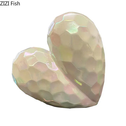 Iridescent gold and silver ceramic statue with faceted honeycomb surface heart shape for home decor by decorbites golden heart