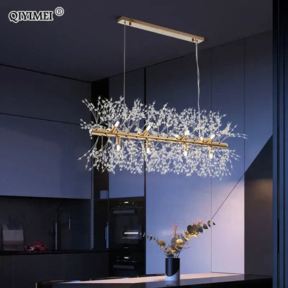 Gold-toned modern chandelier with delicate crystal branches and embedded lights from qiyimei decorbites gold silver led collection