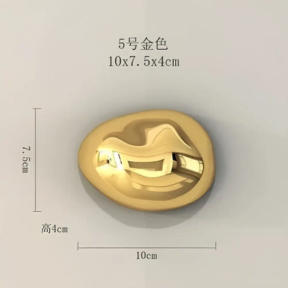 Modern gold metallic 5-number model oval button with smooth finish used as wall hanging ornaments for living room decor