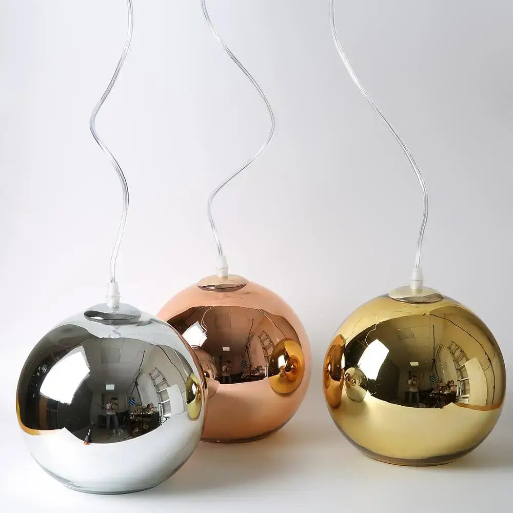 Three spherical decorbites glass bubble pendant lights in silver rose gold and gold for modern kitchen decor