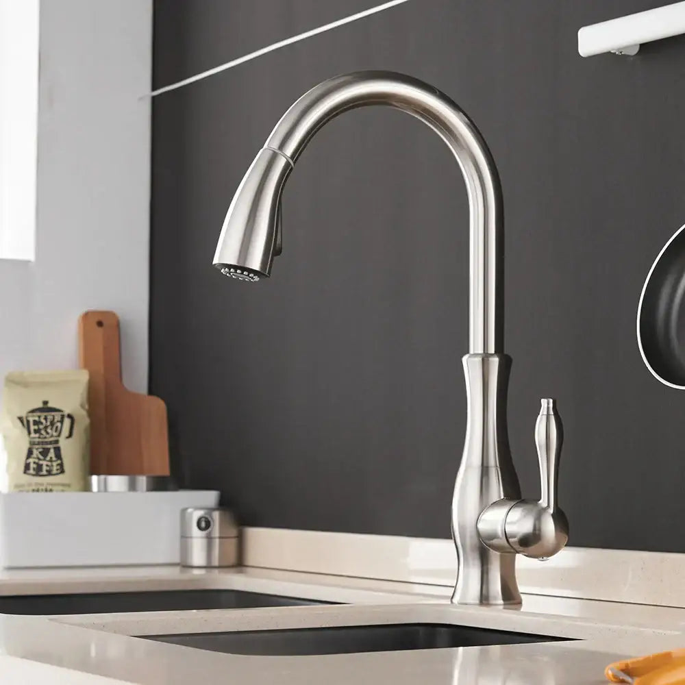 Modern gold single handle stainless steel kitchen faucet with sleek curved spout and pull-down spray head for decorbites gold single handle design