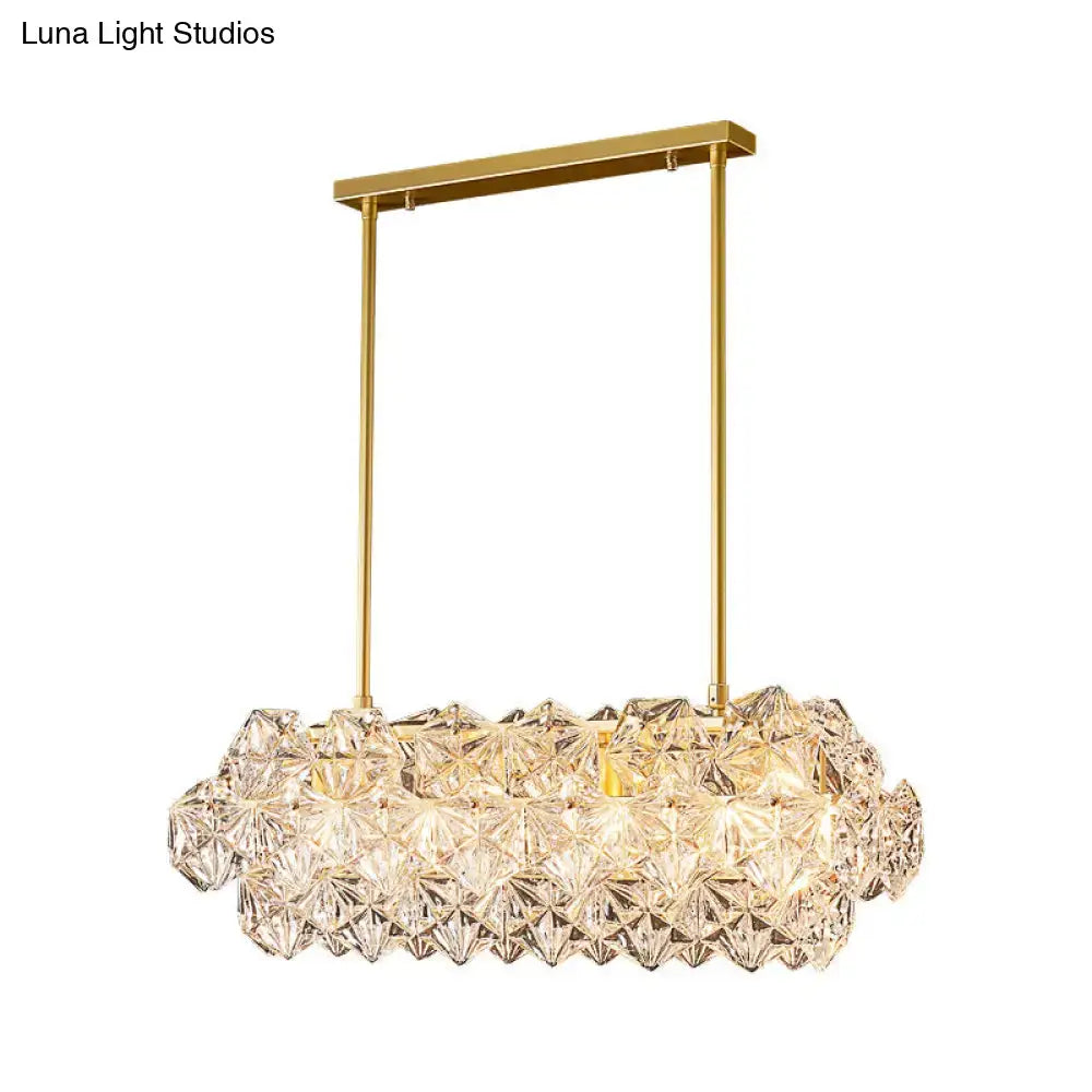 Gold-finished decorbites sleek 4-bulb snowflake crystal pendant light with clear faceted crystals in oblong shape