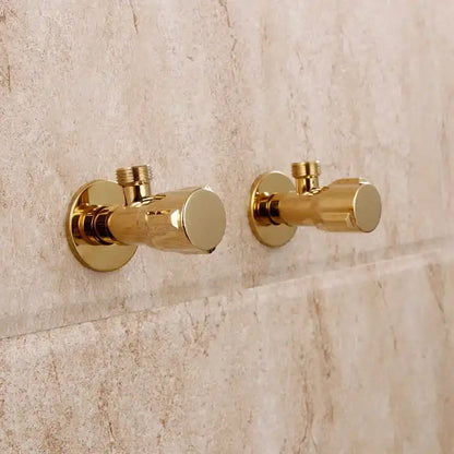 Pair of modern gold solid brass triangle valve bathroom faucets with polished finish mounted on tiled wall