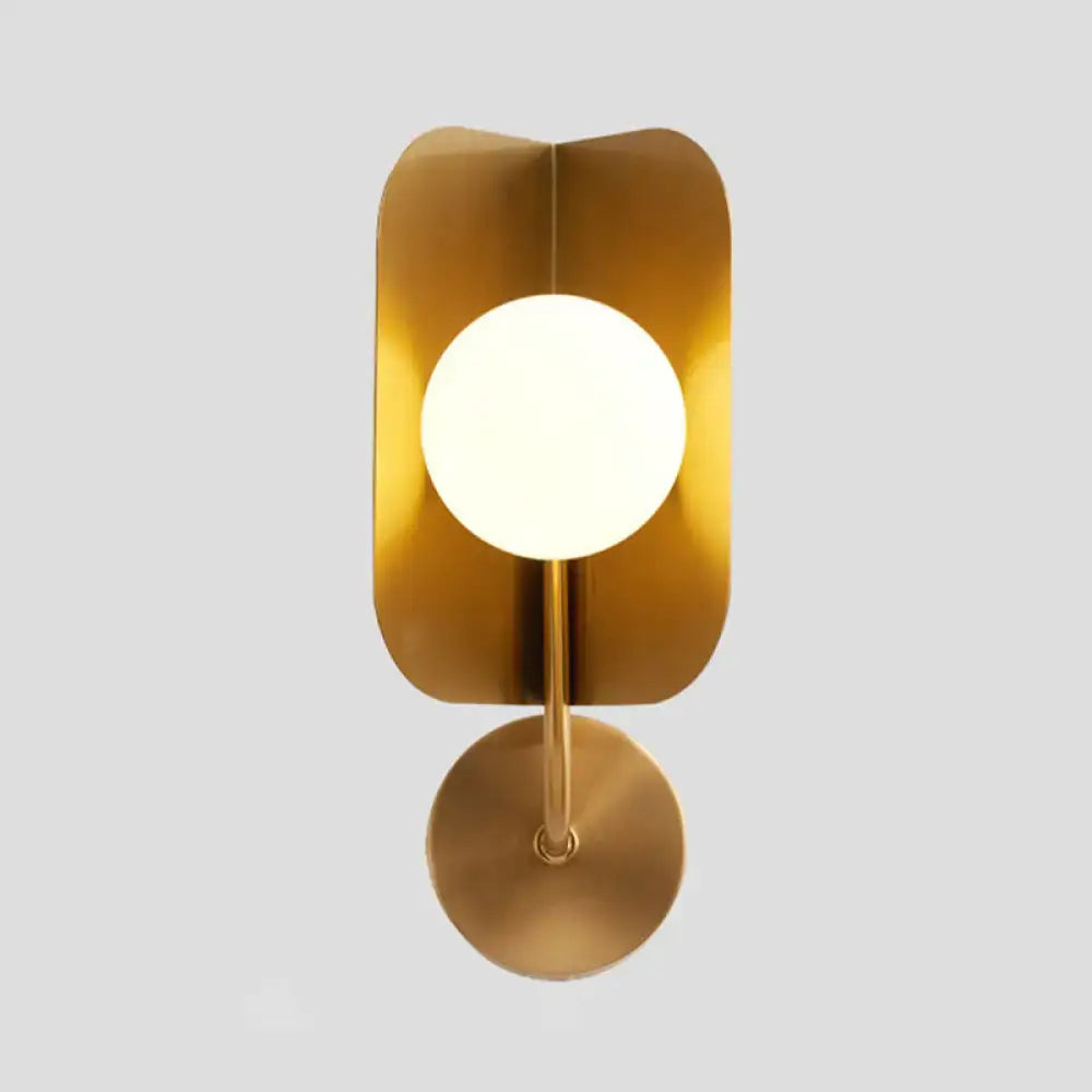 Modern gold metal wall light with curved rectangular backplate and circular frosted led bulb for bedroom sconce