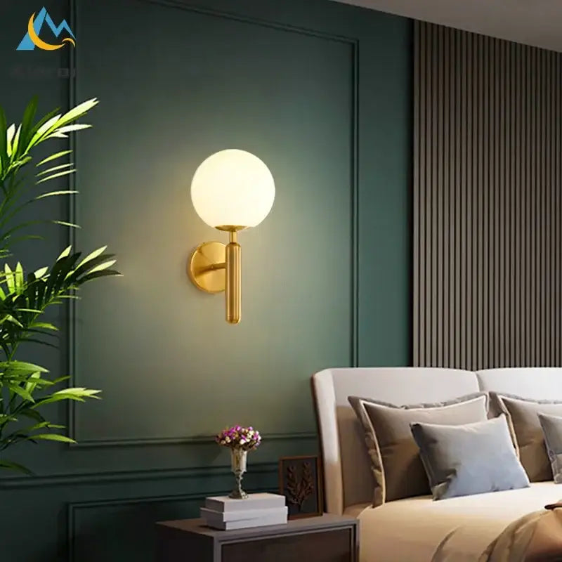 Modern gold spherical frosted glass led wall lamp featuring a gold-toned finish for bedroom wall lamps and led wall lighting